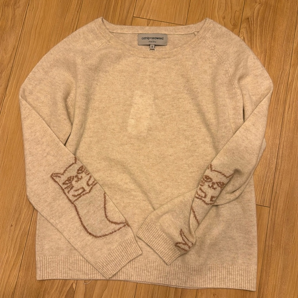 the cashmere sweater in almond